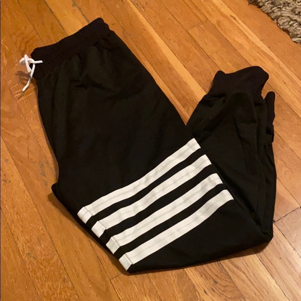 Trendy black sweatpants with white lines
